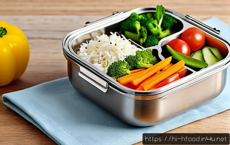 다이어트 도시락 브랜드 비교 - A sleek, multi-chamber stainless steel lunch box with airtight and insulated features, placed on a w...